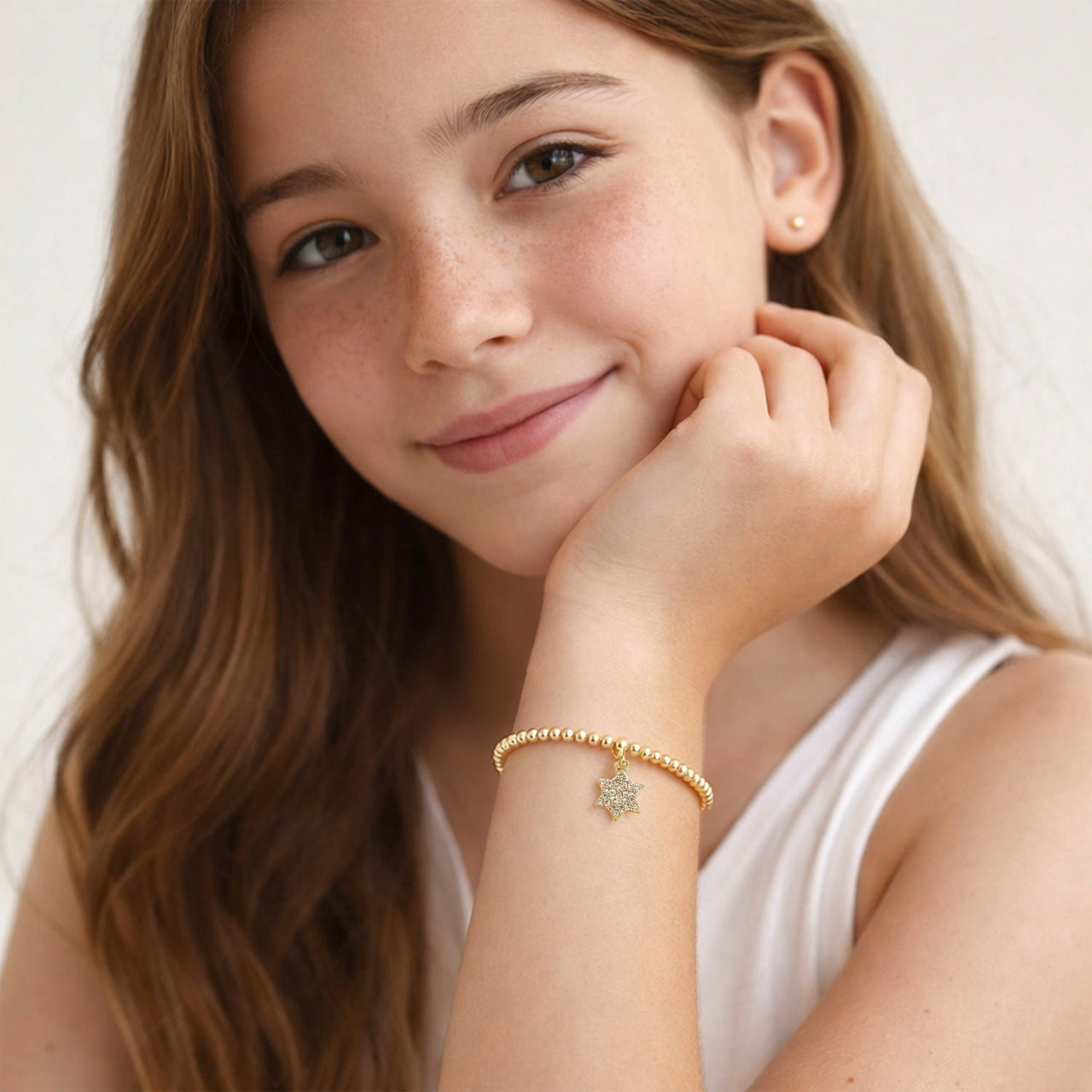bat mitzvah girl wearing gold star of david bracelet gift idea
