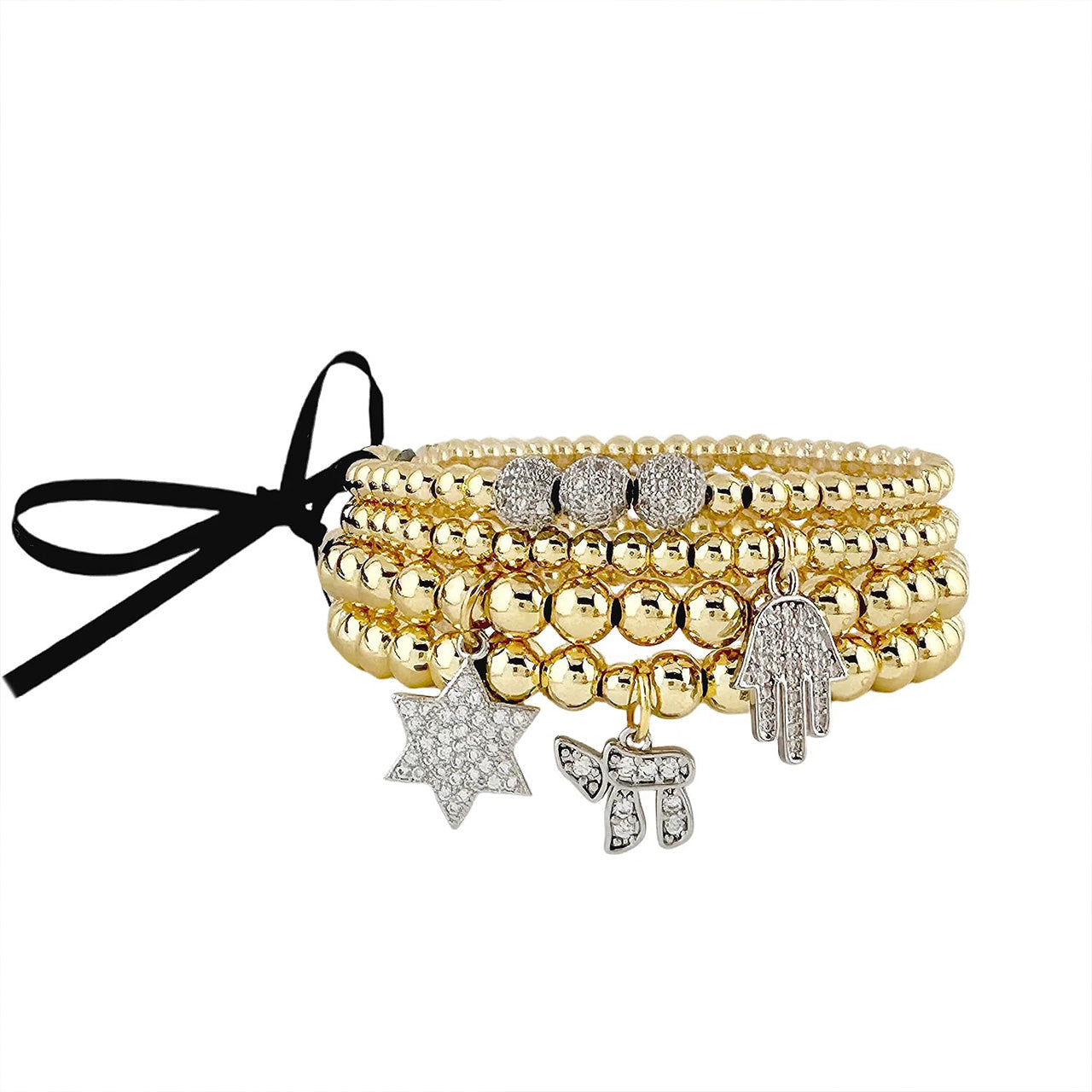 Gold Judaica bracelet stack with Star of David Chai and Hamsa charms representing faith protection and meaningful Jewish jewelry
