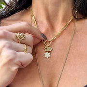 Hebrew chai gold necklace on a model