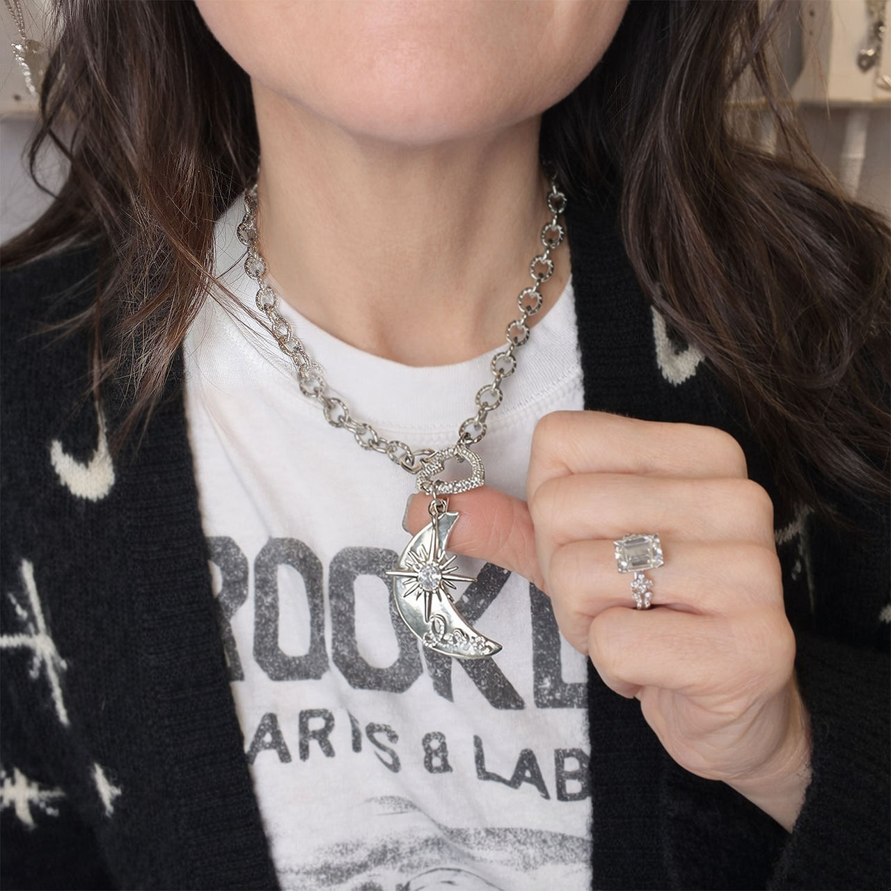 Love Lisa moon and star heart necklace worn showing bold chain and symbolic crystal charms