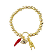 Gold beaded protection charm bracelet with cornicello, evil eye, and hand charms by Love, Lisa

