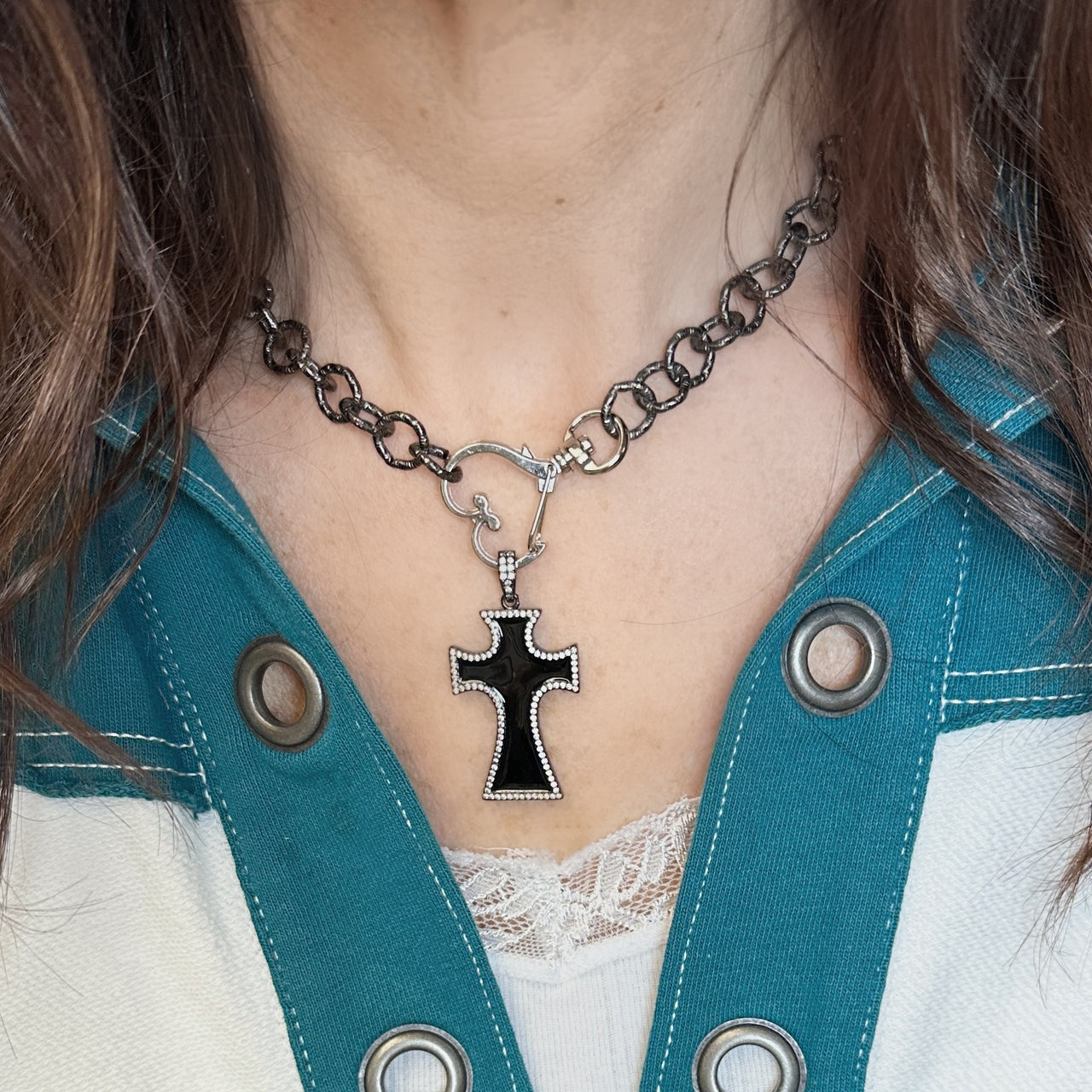 Model wearing black Sandy Enamel Cross Pendant on a chunky chain necklace