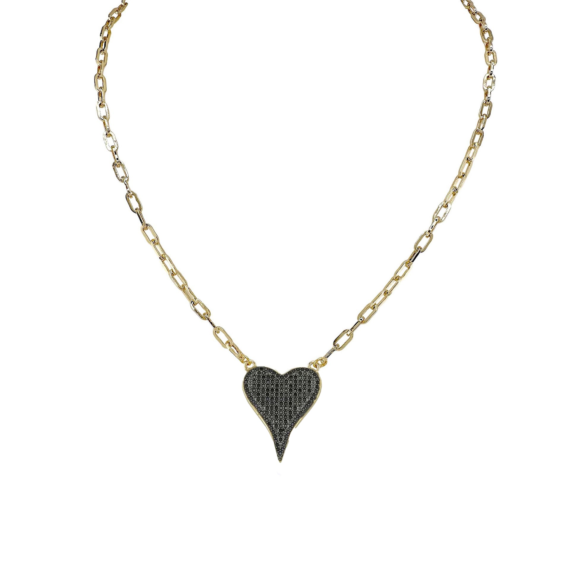 A gold-colored necklace with a paperclip chain and a heart-shaped pendant with black crystals.