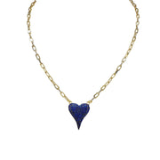 A gold-colored necklace with a paperclip chain and a heart-shaped pendant with blue crystals.