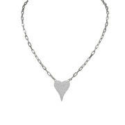 A silver-colored necklace with a paperclip chain and a heart-shaped pendant with silver crystals.
