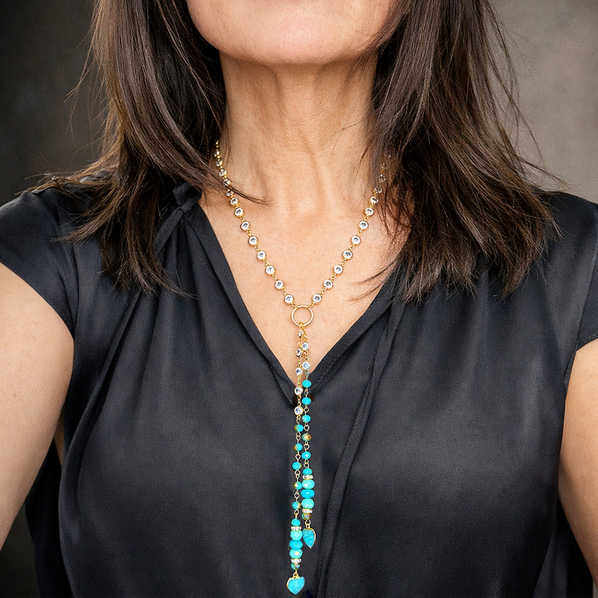 Love Lisa Alessia amazonite heart gemstone drop necklace worn on model featuring cascading amazonite heart gemstones with long drop silhouette