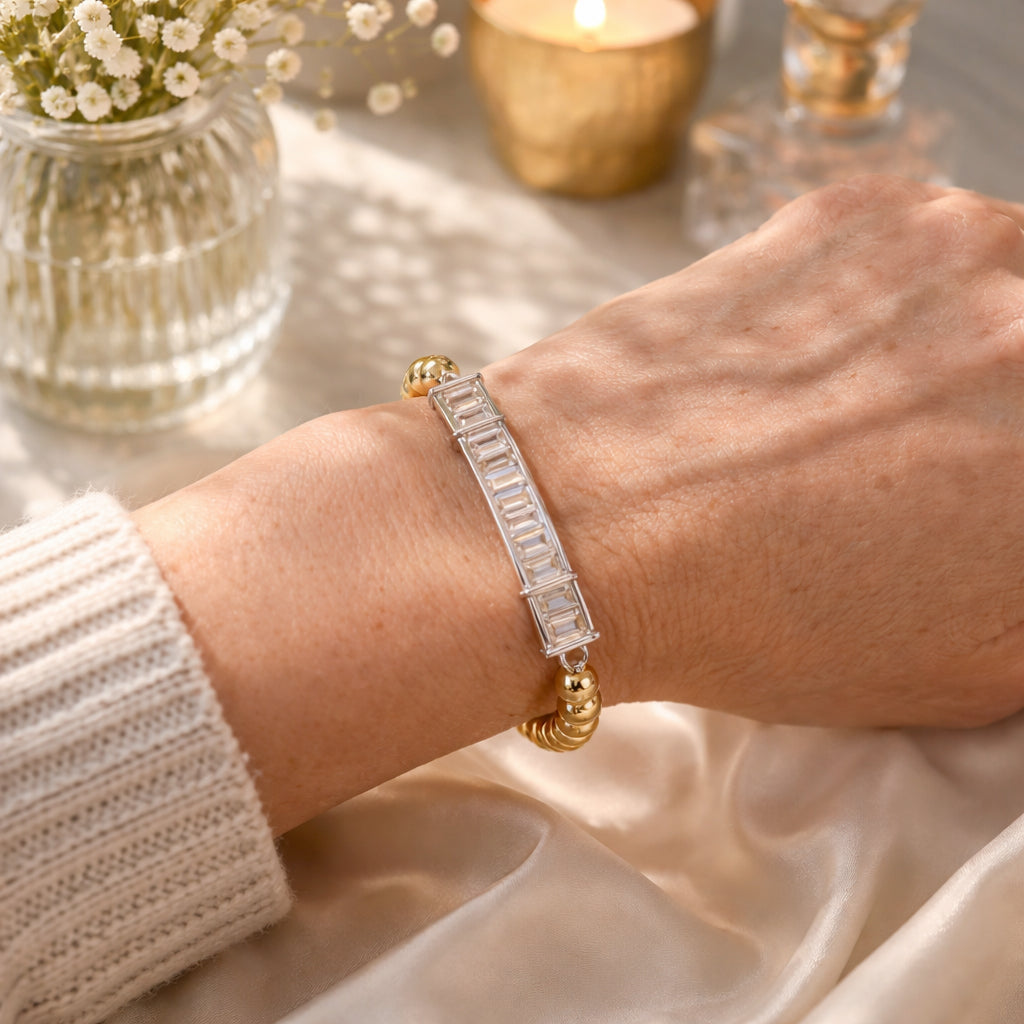 Alicia baguette beaded bracelet in gold on a model