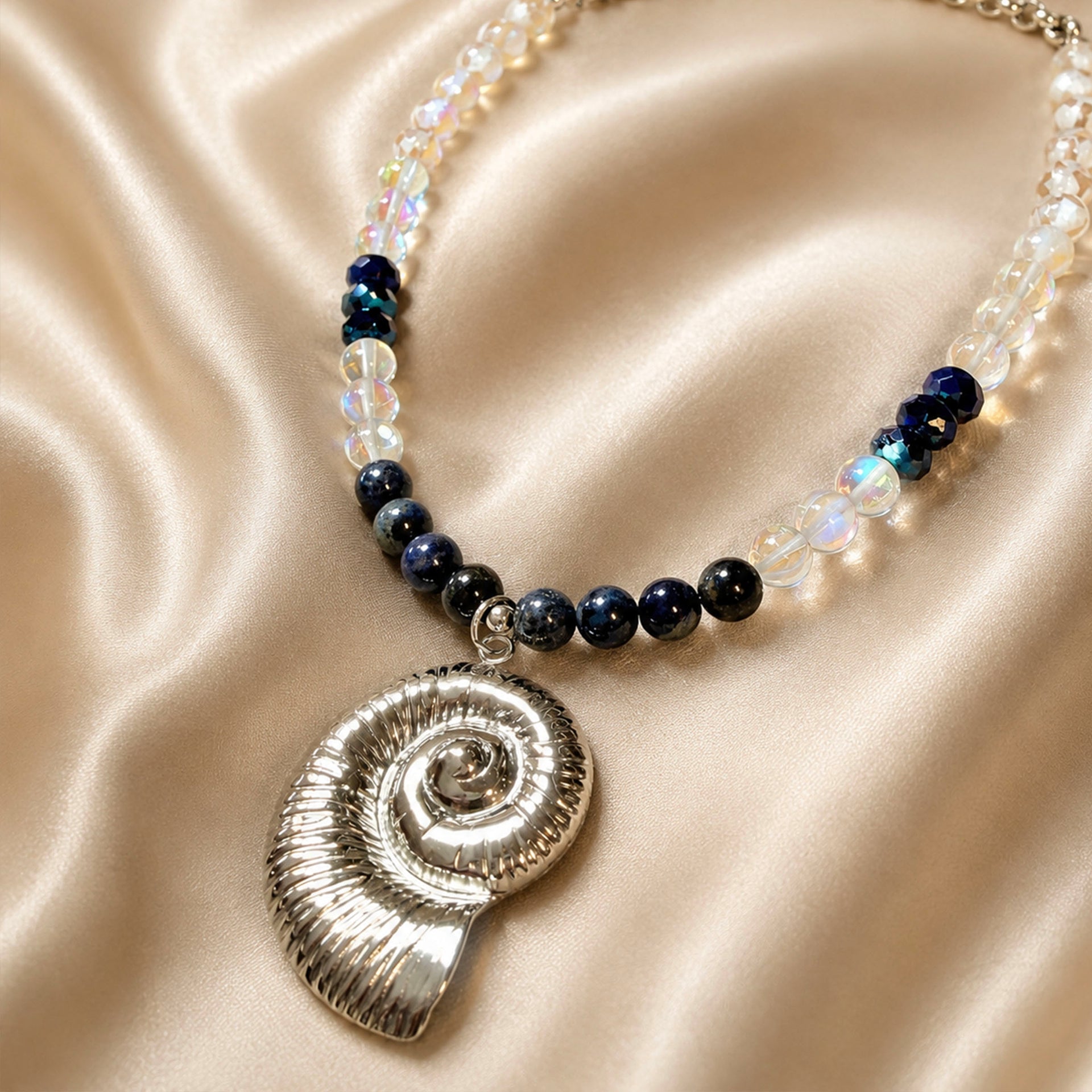 Italian Riviera Amalfi shell gemstone necklace with deep blue pale gemstones and silver spiral shell pendant