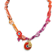 Sicilian ladybug talisman bandana necklace with orange raspberry fabric evil eye beads and gold ladybug charm