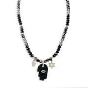 Love Lisa Amalia Gemstone Hamsa Protection Necklace with black and grey rondelle beads, black gemstone Hamsa pendant, silver-tone Hamsa and Star of David charms, and CZ accents