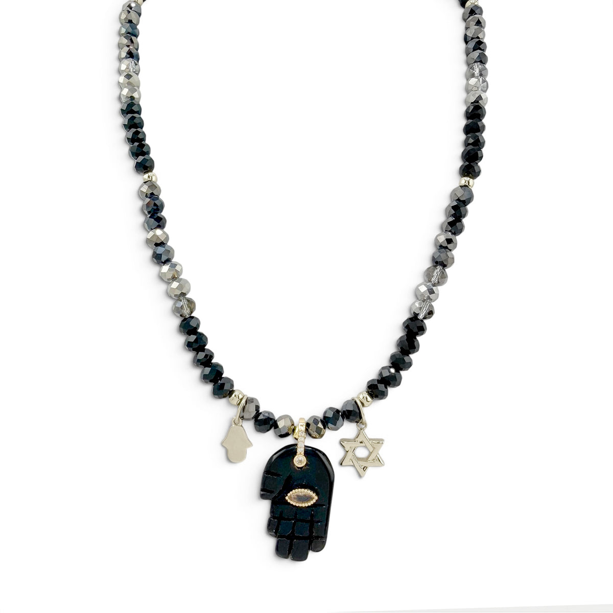 Love Lisa Amalia Gemstone Hamsa Protection Necklace with black and grey rondelle beads, black gemstone Hamsa pendant, silver-tone Hamsa and Star of David charms, and CZ accents