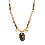 Love Lisa Amalia Hamsa necklace with warm brown and neutral rondelle beads, brown gemstone Hamsa pendant, petite gold-tone Hamsa, Star of David charm, and CZ accents
