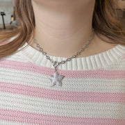 Close-up of Amanda Heart Chain Necklace in silver worn on neck, featuring sparkling crystal stations and heart link detail
