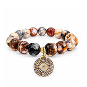 Love Lisa Amara Evil Eye Gemstone Bracelet with faceted Brown Fire Agate beads, round crystal evil eye charm, and gold-tone settin