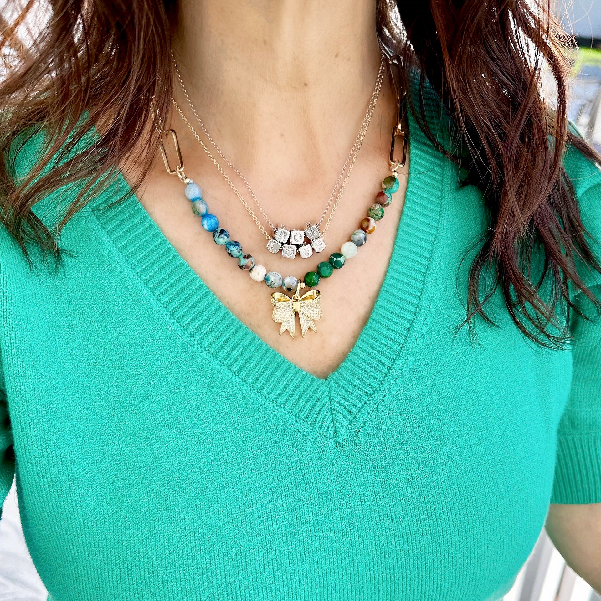 Amelia personalized necklace layered with multiple letters