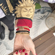 Angel Number Bracelets by Love Lisa stacked on wrist in multiple colors