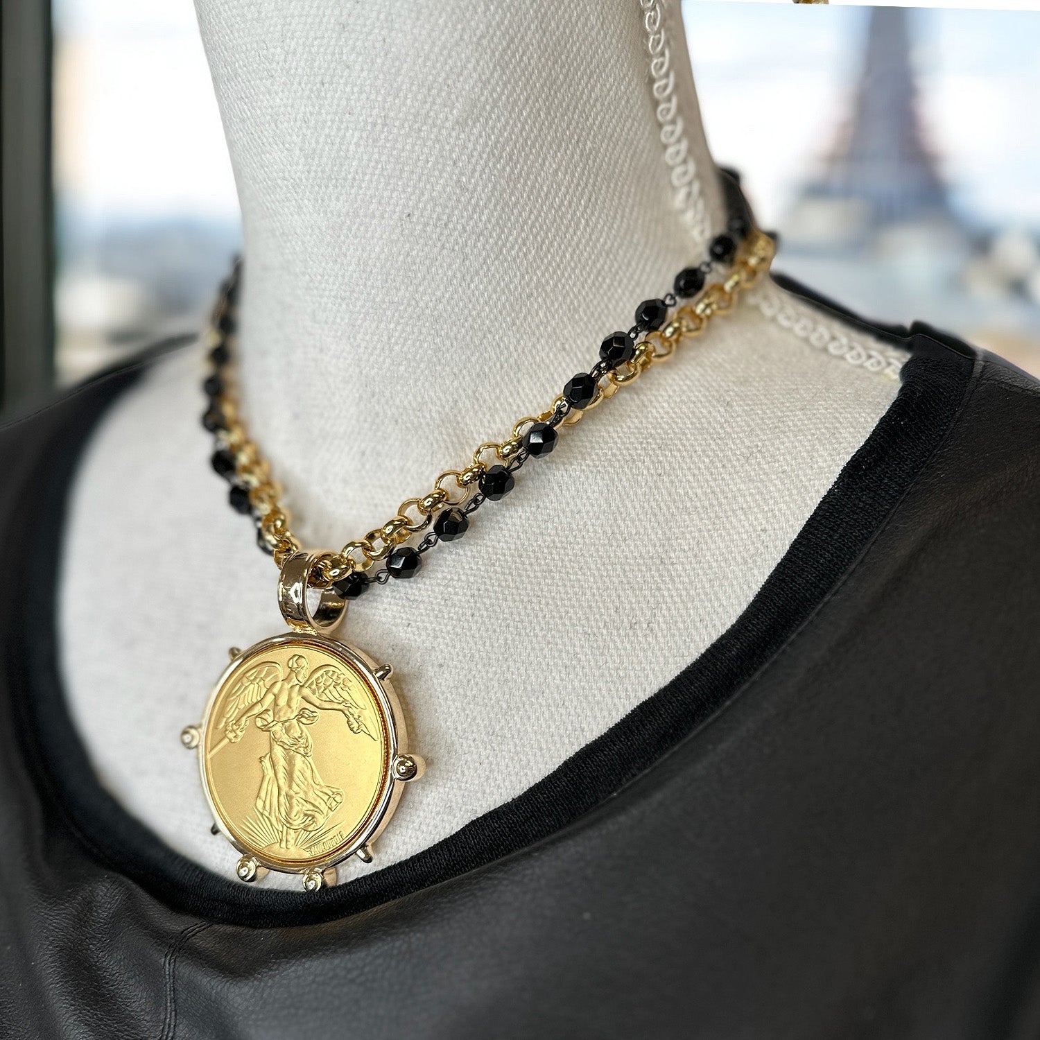 angelica french coin necklace styled on mannequin gold pendant with angel design and beaded chain love lisa