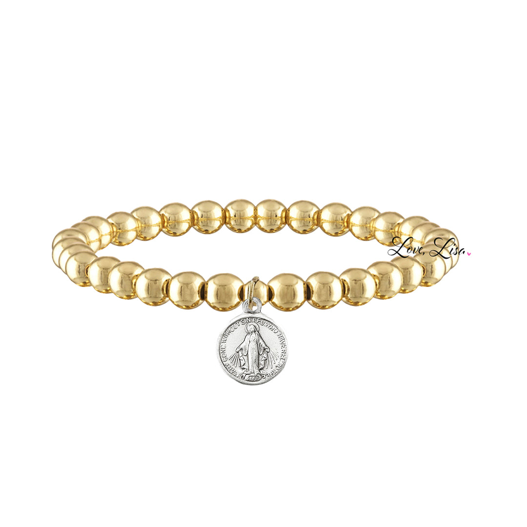 A collection of beaded bracelets with various metallic finishes and Saint medals.