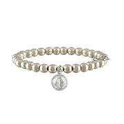 A collection of beaded bracelets with various metallic finishes and Saint medals.