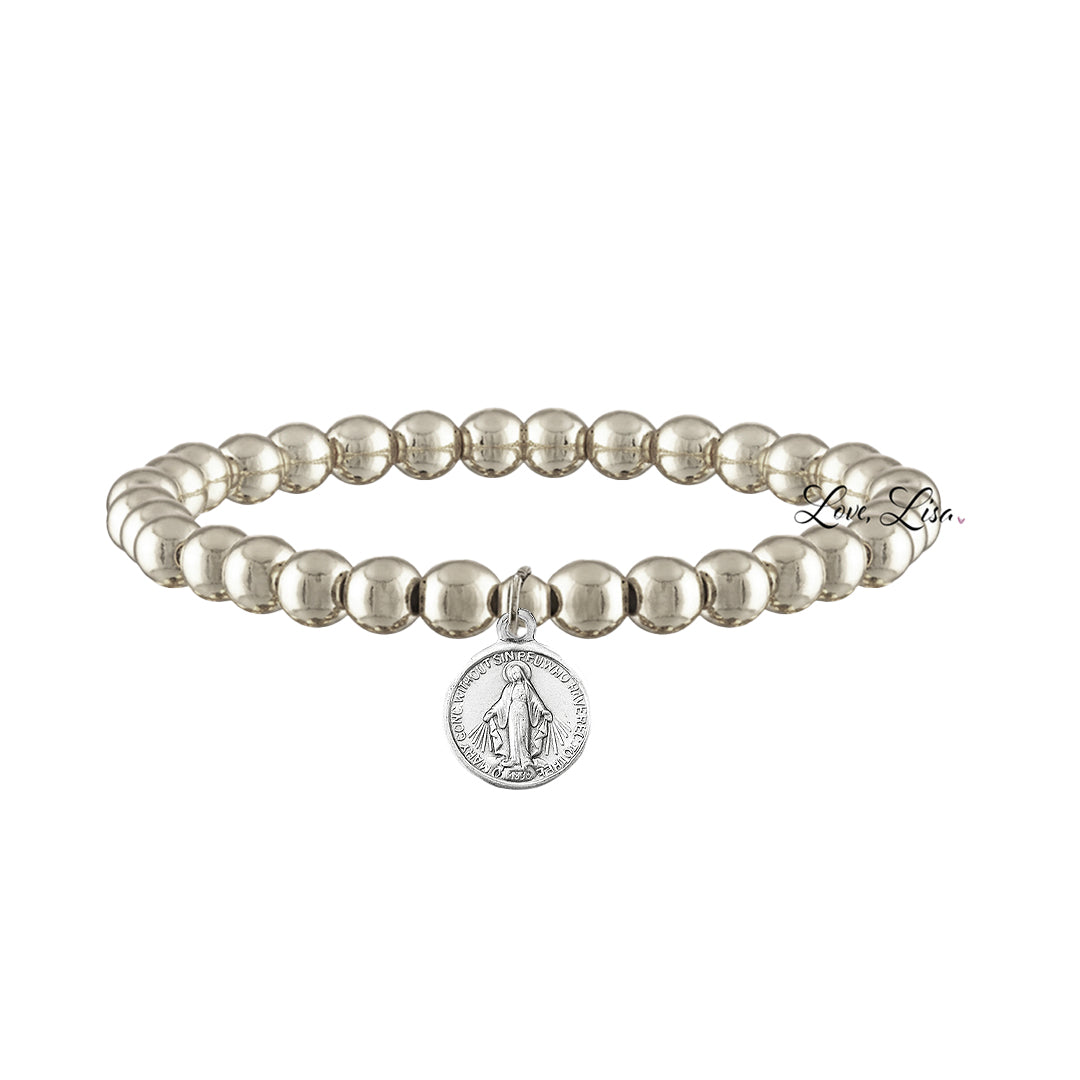 A collection of beaded bracelets with various metallic finishes and Saint medals.