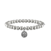 A collection of beaded bracelets with various metallic finishes and Saint medals.