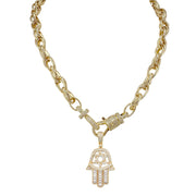 Gold chain necklace with a Hamsa hand pendant on a white background