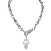 Silver chain necklace with a Hamsa hand pendant on a white background