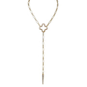 Gold necklace with clover pendant on a white background