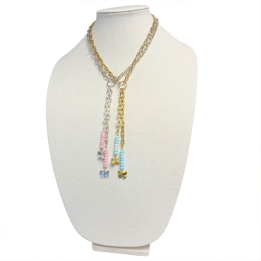 Love Lisa Bailey butterfly drop necklace display showing multiple color options with paperclip chain and cascading bead drops