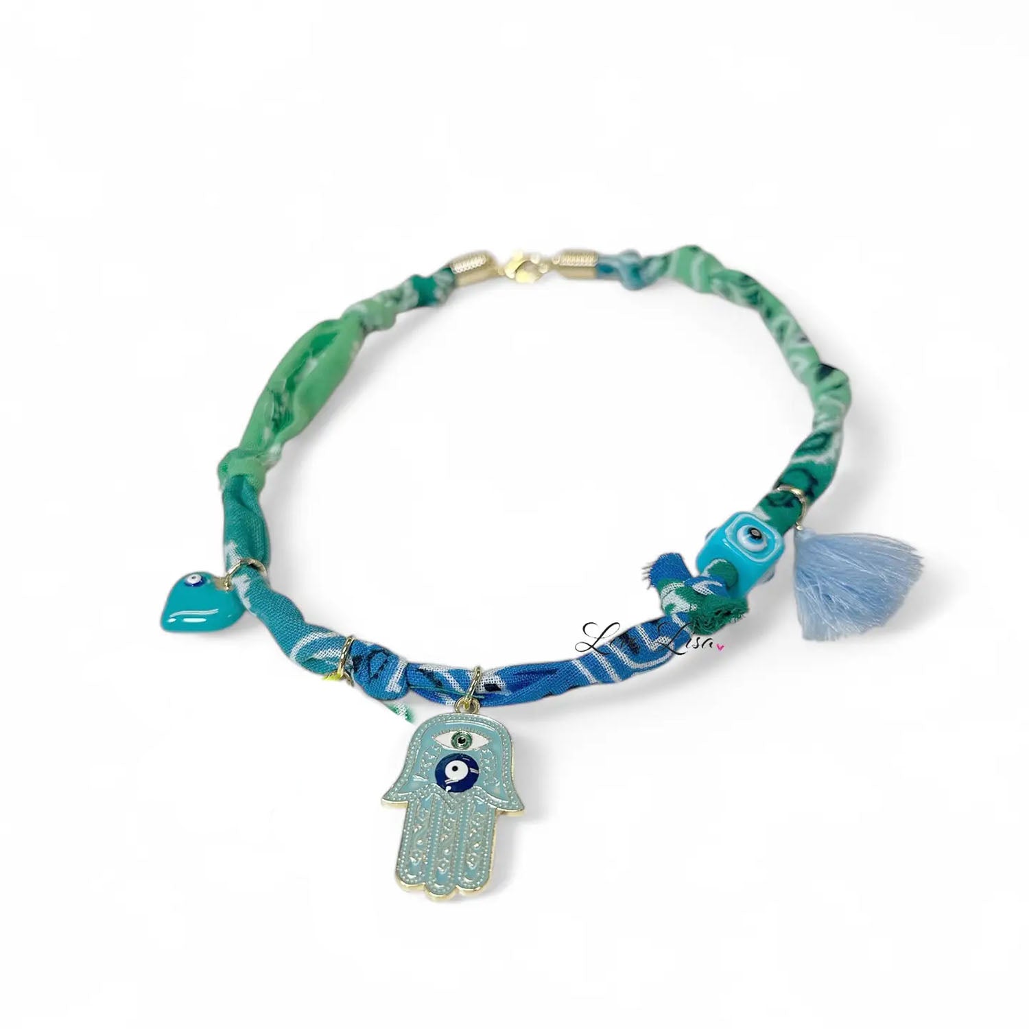 Decorative bracelet with blue and green beads and Hamsa charm on a white background