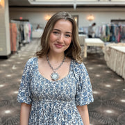 Model wearing Bari Coin Necklace with LOVE medallion crystal sunburst and heart clasp by Love Lisa