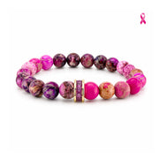Love Lisa Bellissima Breast Cancer Awareness Bracelet with pink, berry, and plum Sea Sediment Jasper beads, sparkling crystal rondelle centerpiece, and polished gold-tone accents