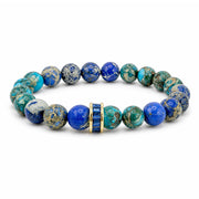 Bellissima Crystal Rondelle Gemstone Bracelet in Blue with Sea Sediment Jasper beads, gold-tone accents, and crystal centerpiece