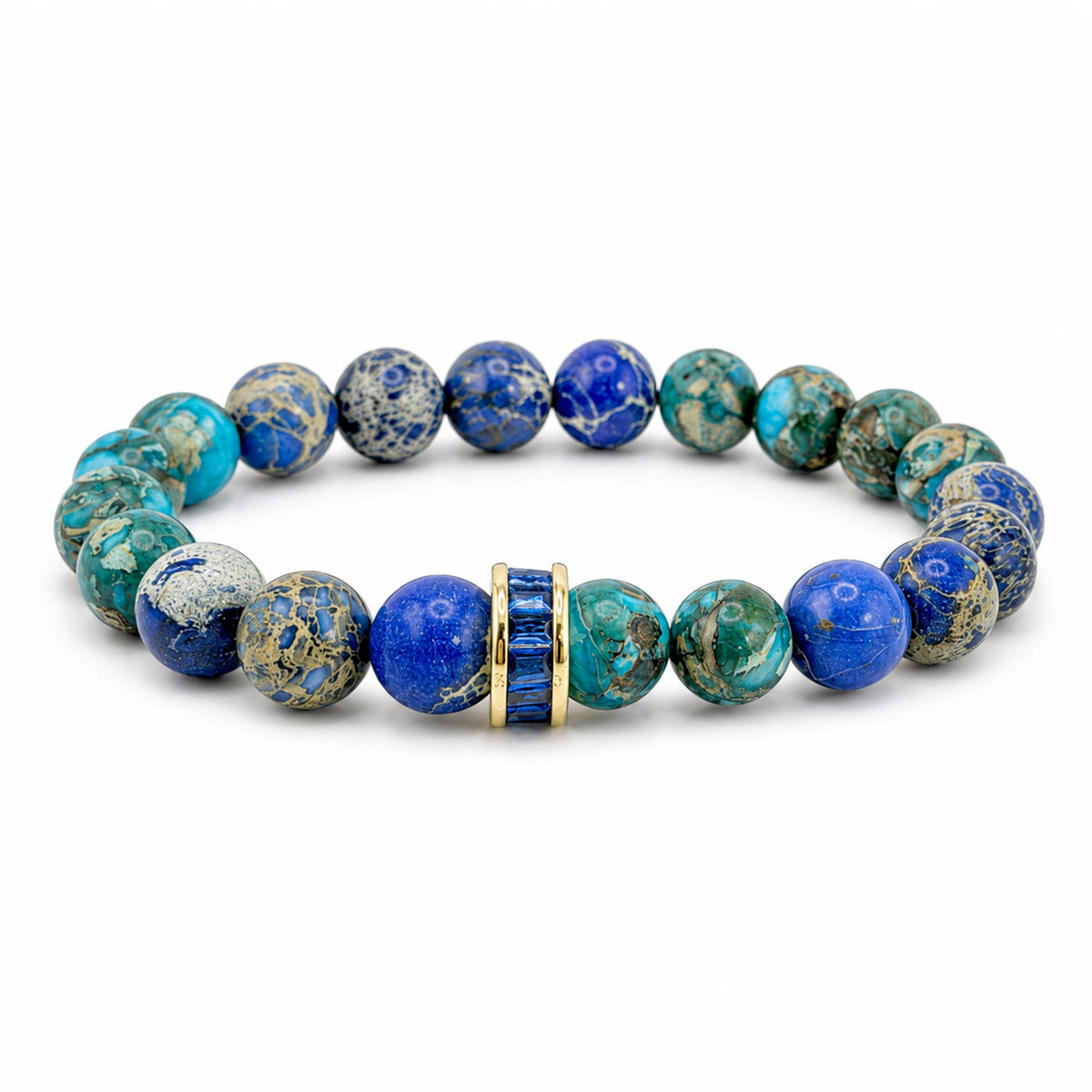 Bellissima Crystal Rondelle Gemstone Bracelet in Blue with Sea Sediment Jasper beads, gold-tone accents, and crystal centerpiece