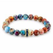 Bellissima Crystal Rondelle Gemstone Bracelet in Blueberry with Sea Sediment Jasper beads, gold-tone accents, and crystal centerpiece
