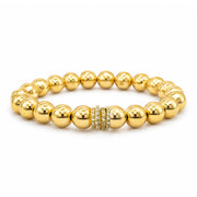 Bellissima Luxe Bracelet with polished gold-tone beads and a fully crystal-encrusted pavé rondelle centerpiece