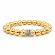 Bellissima Luxe Bracelet with polished gold-tone beads and a fully crystal-encrusted silver pavé rondelle centerpiece