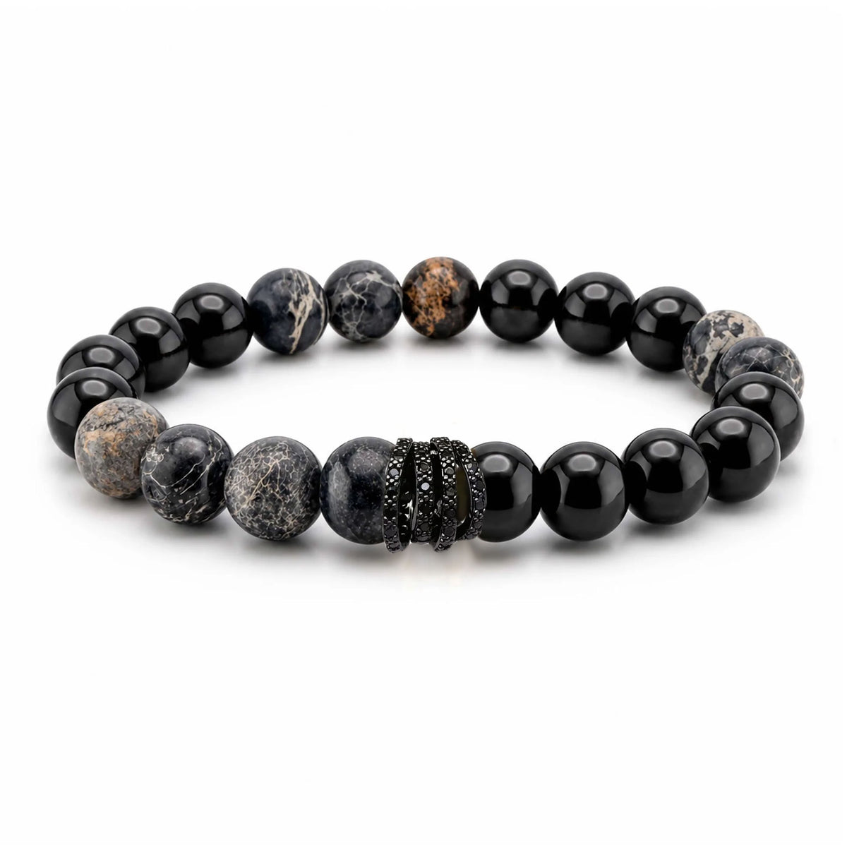 A beaded stretch bracelet featuring a mix of polished black beads, matte black-and-white marbled beads, and a textured black spacer, displayed on a clean white background.