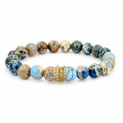Bellissima Luxe Bracelet with light blue and neutral Sea Sediment Jasper beads and a sparkling pavé crystal rondelle centerpiece