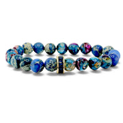 Bellissima Crystal Rondelle Gemstone Bracelet in blues with Sea Sediment Jasper beads, gold-tone accents, and crystal centerpiece