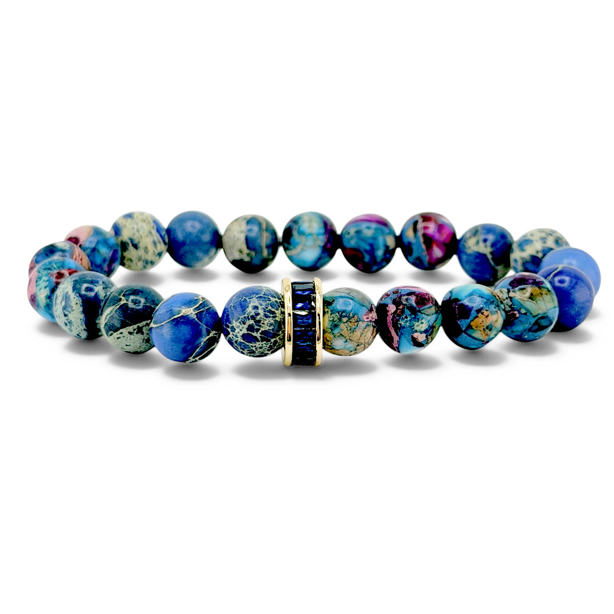 Bellissima Crystal Rondelle Gemstone Bracelet in blues with Sea Sediment Jasper beads, gold-tone accents, and crystal centerpiece