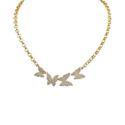 
The Betty Butterfly Necklace in gold with crystal butterfly charms on a luxe chain