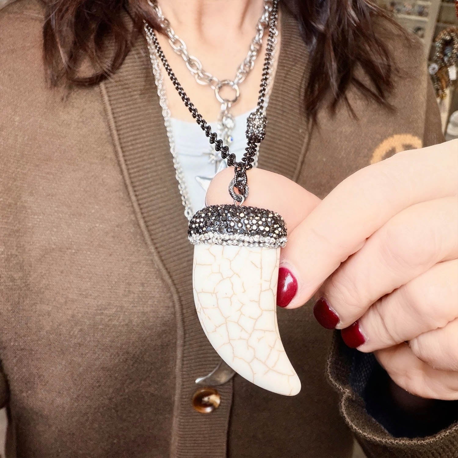 close-up of bianca howlite horn pendant necklace showing detailed crystal pave cap and natural white stone by Love Lis