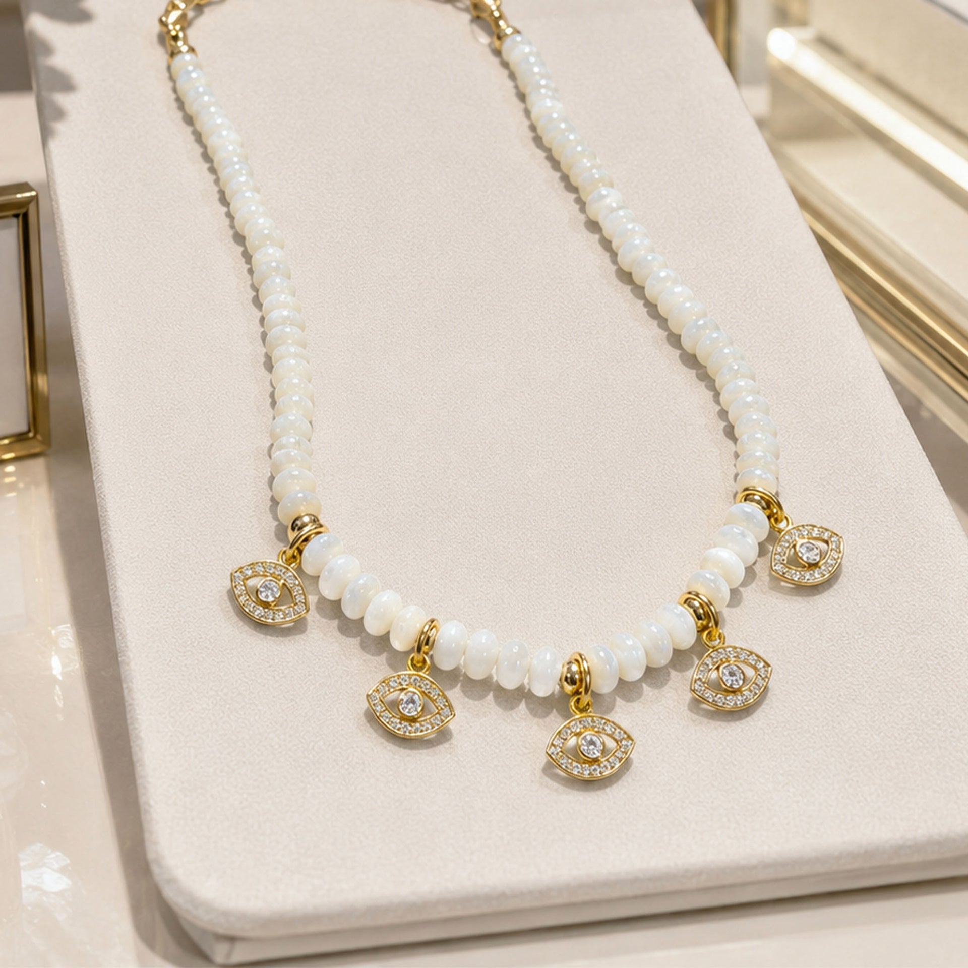 Love Lisa Bianca Mother of Pearl Evil Eye Necklace displayed with white beads and pavé evil eye charm details