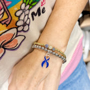 Blue Ribbon Awareness Bracelet by Love Lisa worn on wrist for Type 1 Diabetes support