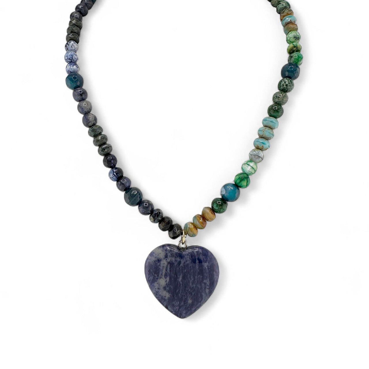 Blue sodalite heart worry stone necklace on deep navy gemstone beads