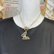 Butterfly jewelry charm with intricate cutout design in gold