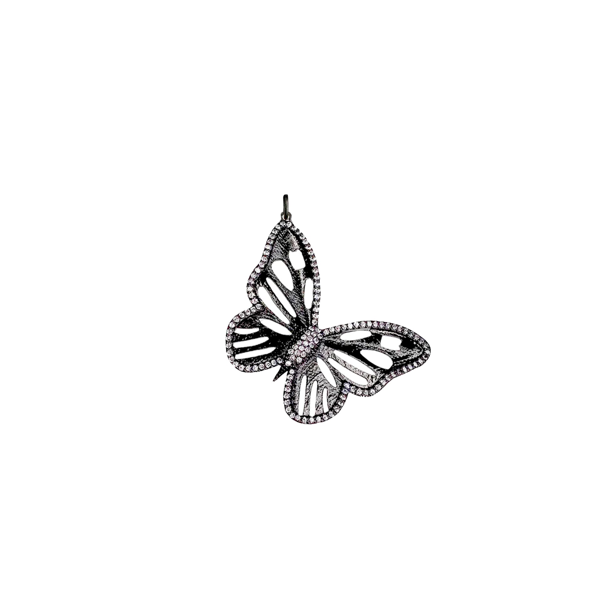 Closeup of gunmetal butterfly charm with shimmer detail

