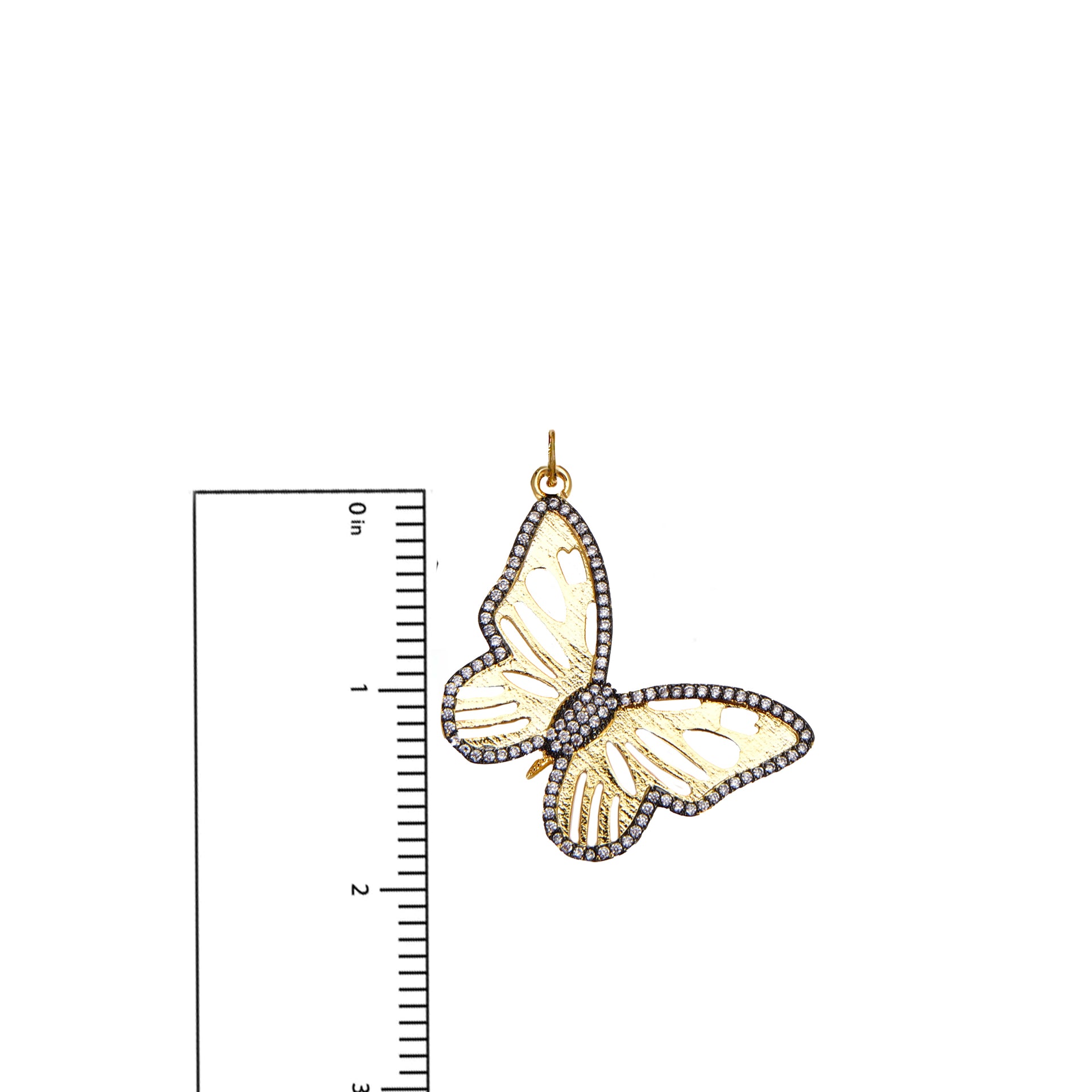 Measurement photo of gold butterfly charm with ruler