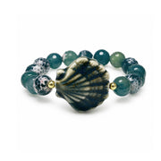Calista Ceramic Shell Gemstone Bracelet in Ocean Mist with deep green blue faceted gemstone beads and glazed ceramic shell centerpiece